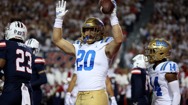 Nov 4, 2023; Tucson, Arizona, USA; UCLA Bruins running back Carsen Ryan #20 celebrates a touchdown against the Arizona Wildcats during the first half at Arizona Stadium. Mandatory Credit: Zachary BonDurant-USA TODAY Sports